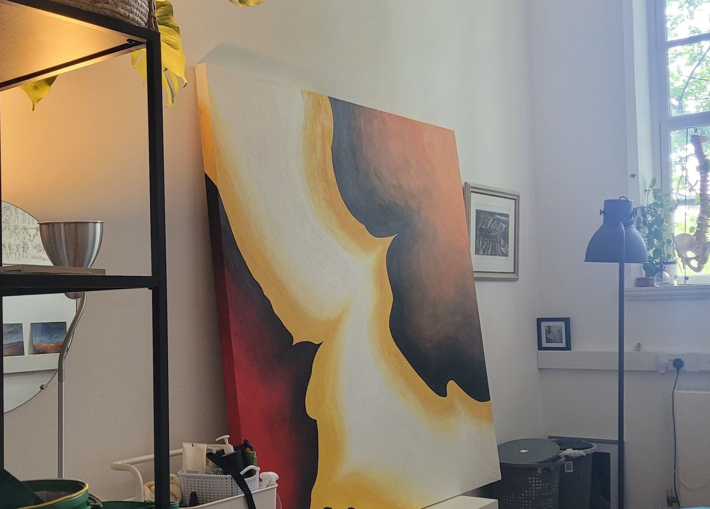 Calm interior at Ouseburn Massage Therapy, Newcastle upon Tyne, England, GB with vibrant artwork and greenery.