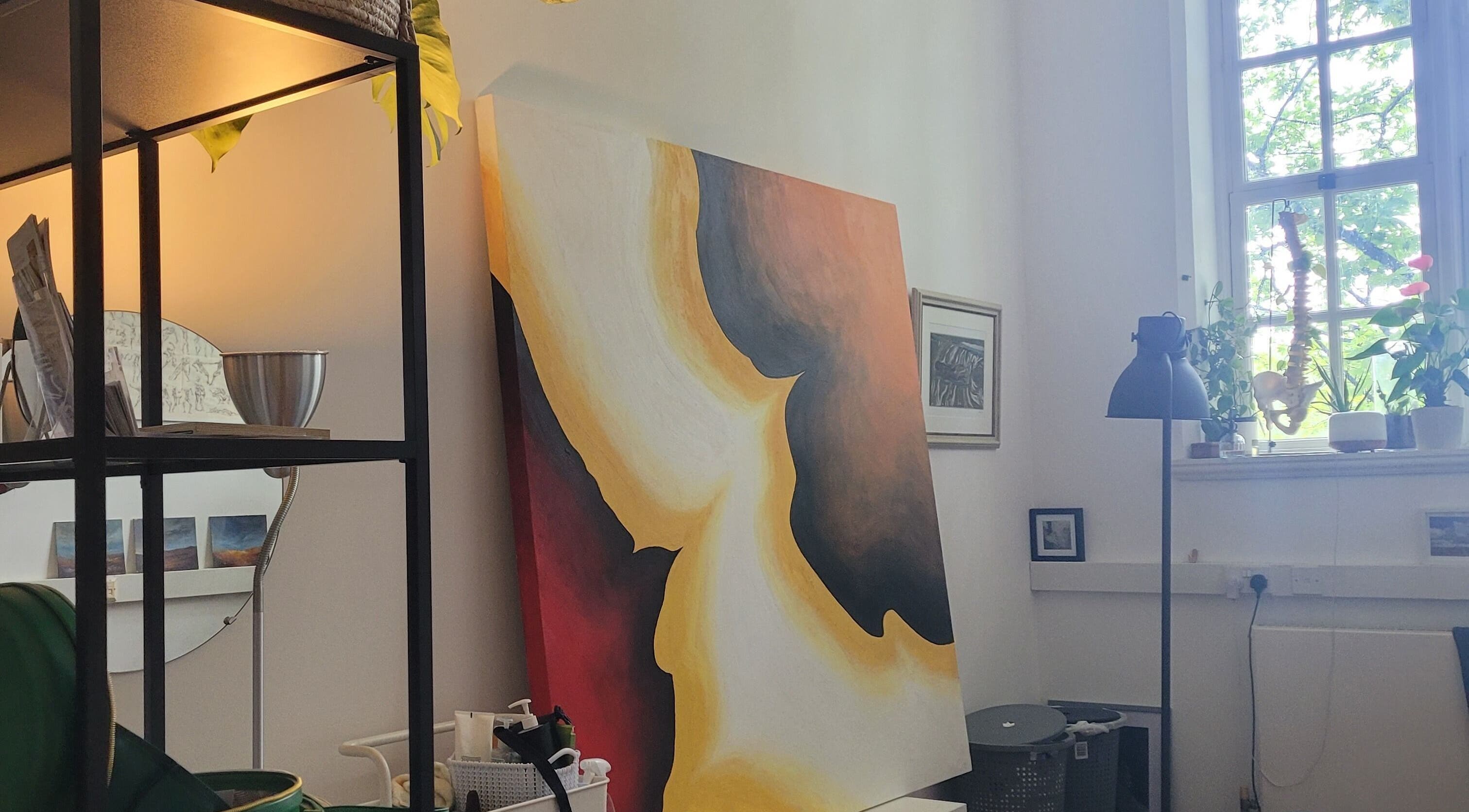 Calm interior at Ouseburn Massage Therapy, Newcastle upon Tyne, England, GB with vibrant artwork and greenery.