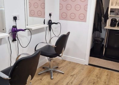 Chic salon setup at Hannah Hairdressing in Penketh, England. Stylish chairs and equipment enhance the space.