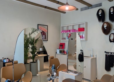 Chic interior of Absa Ladies Beauty Salon in Dubai, Dubai, AE showcasing stylish decor and hairdressing tools.