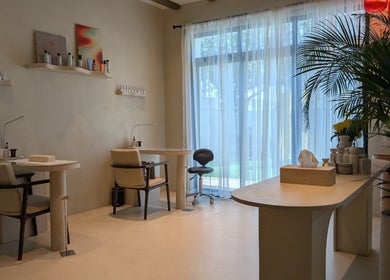 Luxurious nail care area at Absa Ladies Beauty Salon, Dubai, AE with natural lighting and elegant decor.