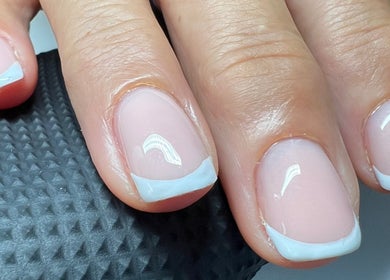 French manicure detail from The Snug Room in Ravenfield, England, GB showcasing pristine nail care.