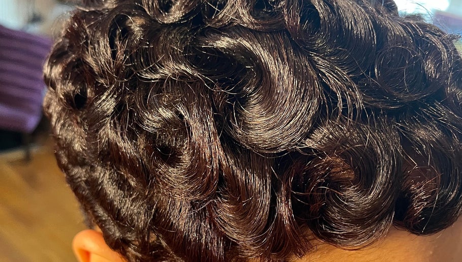 Close-up of sculpted curls hairstyle at The Purple Door Styling & Grooming Lounge, Spartanburg, South Carolina, US.