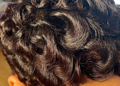 Close-up of sculpted curls hairstyle at The Purple Door Styling & Grooming Lounge, Spartanburg, South Carolina, US.