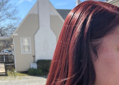 Sleek red hair outside The Purple Door Styling & Grooming Lounge, Spartanburg, South Carolina, US.