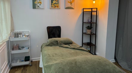 Cozy massage room at Mia Wellness Room in Penryn, England, GB, ready for relaxation and rejuvenation.