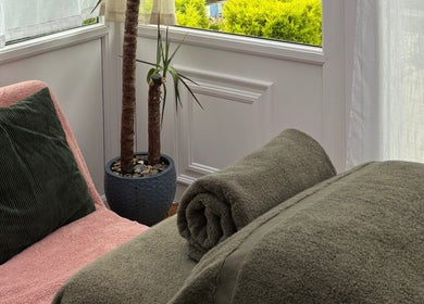 Relaxing therapy corner with cozy towels at Mia Wellness Room, Penryn, England, GB.