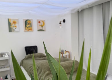 Tranquil treatment room at Mia Wellness Room, Penryn, England, GB, featuring soothing decor and greenery.