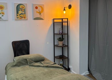 Relaxing therapy room with warm lighting at Mia Wellness Room, Penryn, England, GB.
