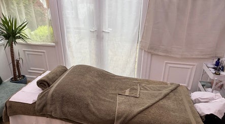 Serene massage table at Mia Wellness Room, Penryn, England, GB, ready for relaxation therapy.