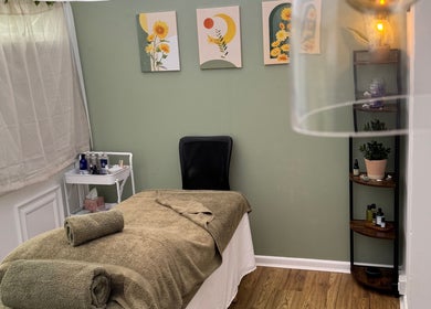 Relaxing therapy room at Mia Wellness Room, Penryn, England, GB with massage bed and calming decor.
