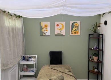 Mia Wellness Room's tranquil therapy space in Penryn, England, GB, featuring serene decor and treatment bed.