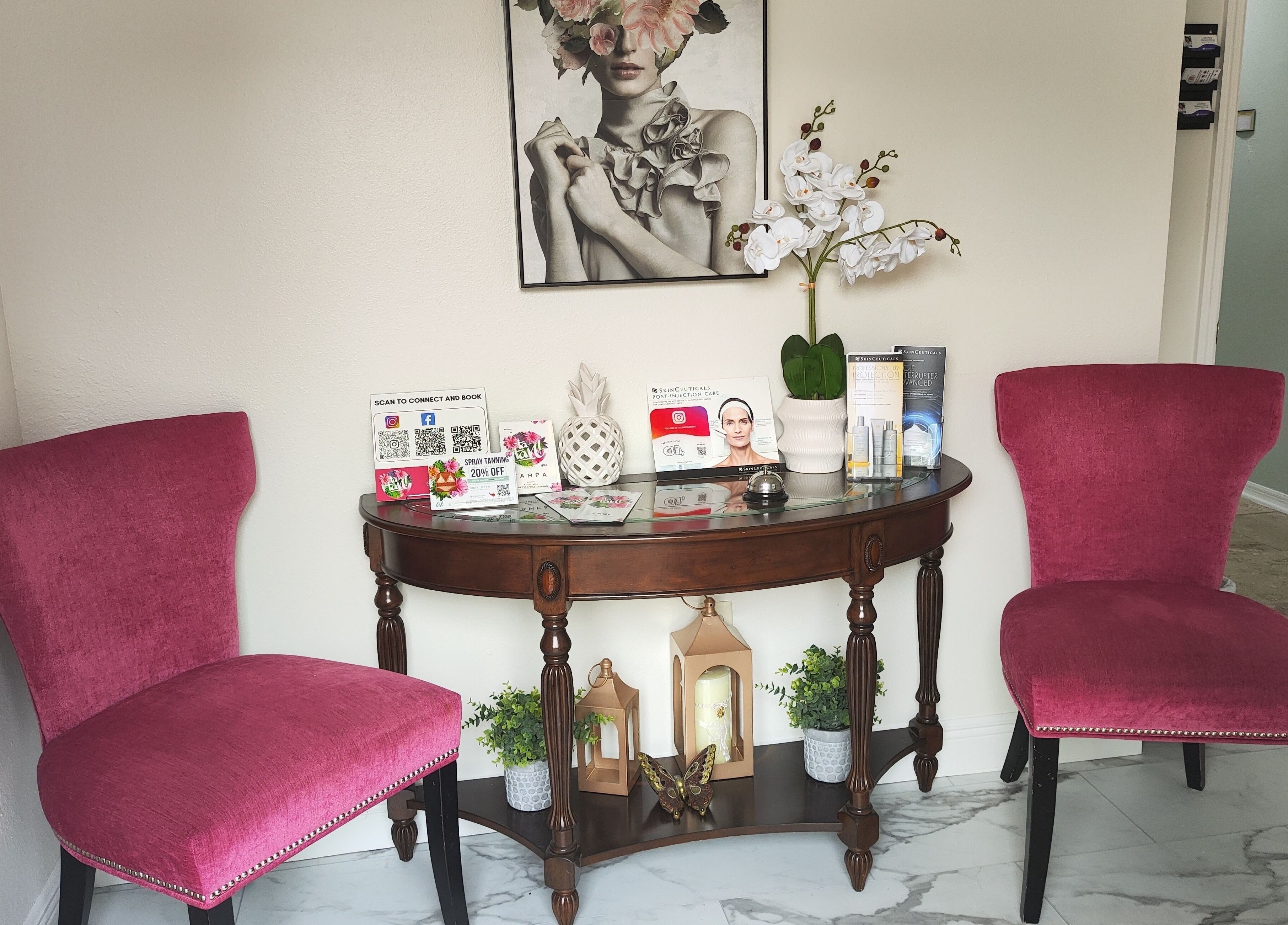 Stylish waiting area at Irina Titovets • Eyelash Extensions, Lutz, Florida, US with pink chairs and elegant decor.