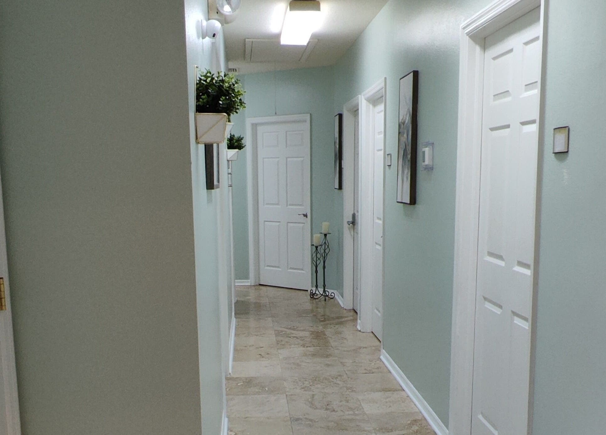 Bright hallway at Irina Titovets • Eyelash Extensions, Lutz, Florida, US, with elegant decor and soft lighting.