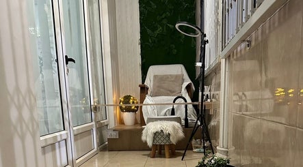 Relaxing seating area at Gorgeous Nail Bar & Lashes in Port Louis District, MU, featuring a plush chair and ambient lighting.