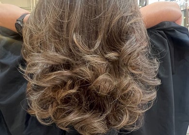 Luscious wavy hairstyle at D_A hair Design in London, England, GB, captured in a salon setting.