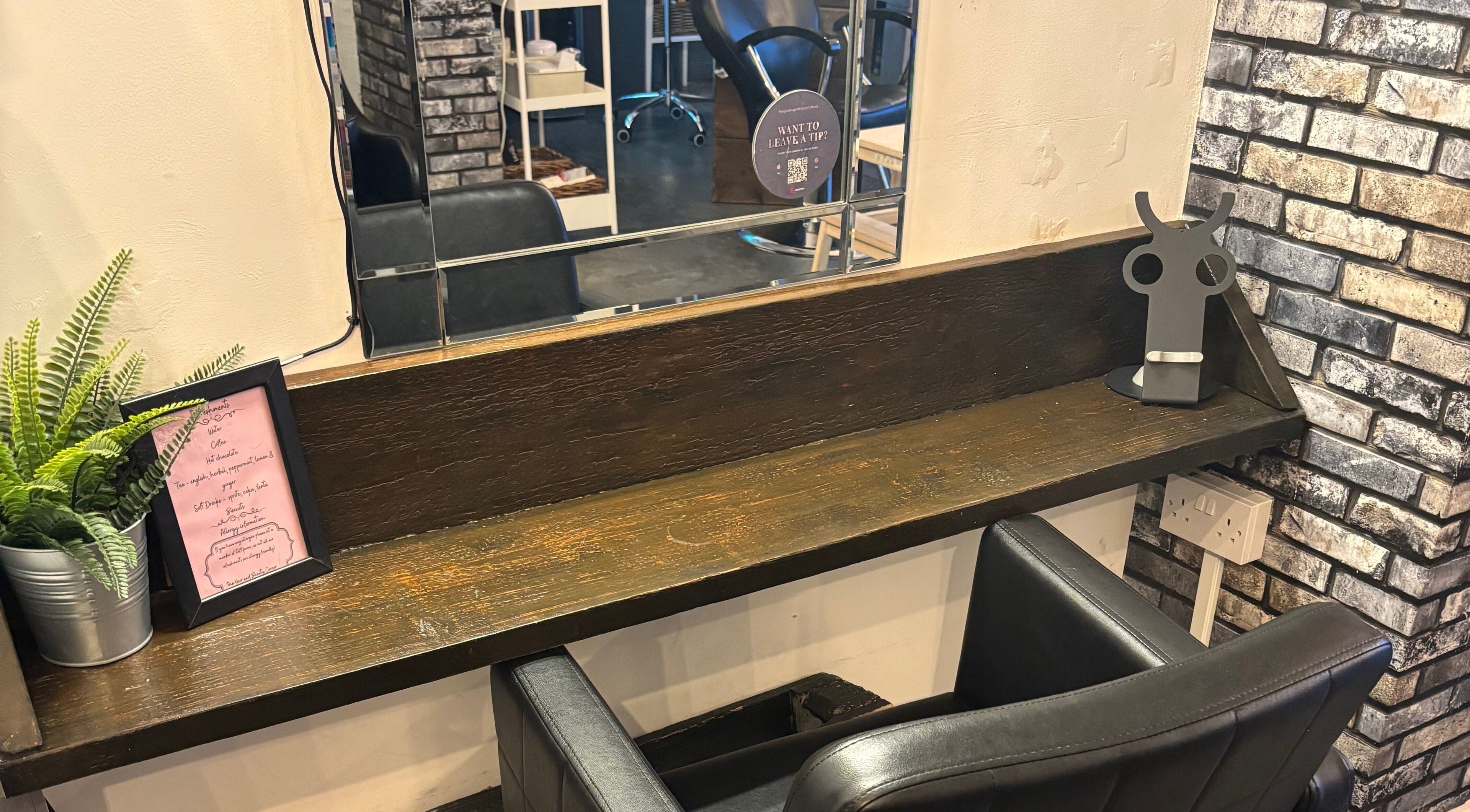 Chic salon seating at The Hair And Beauty Corner, Manchester, England, GB with decorative accents.