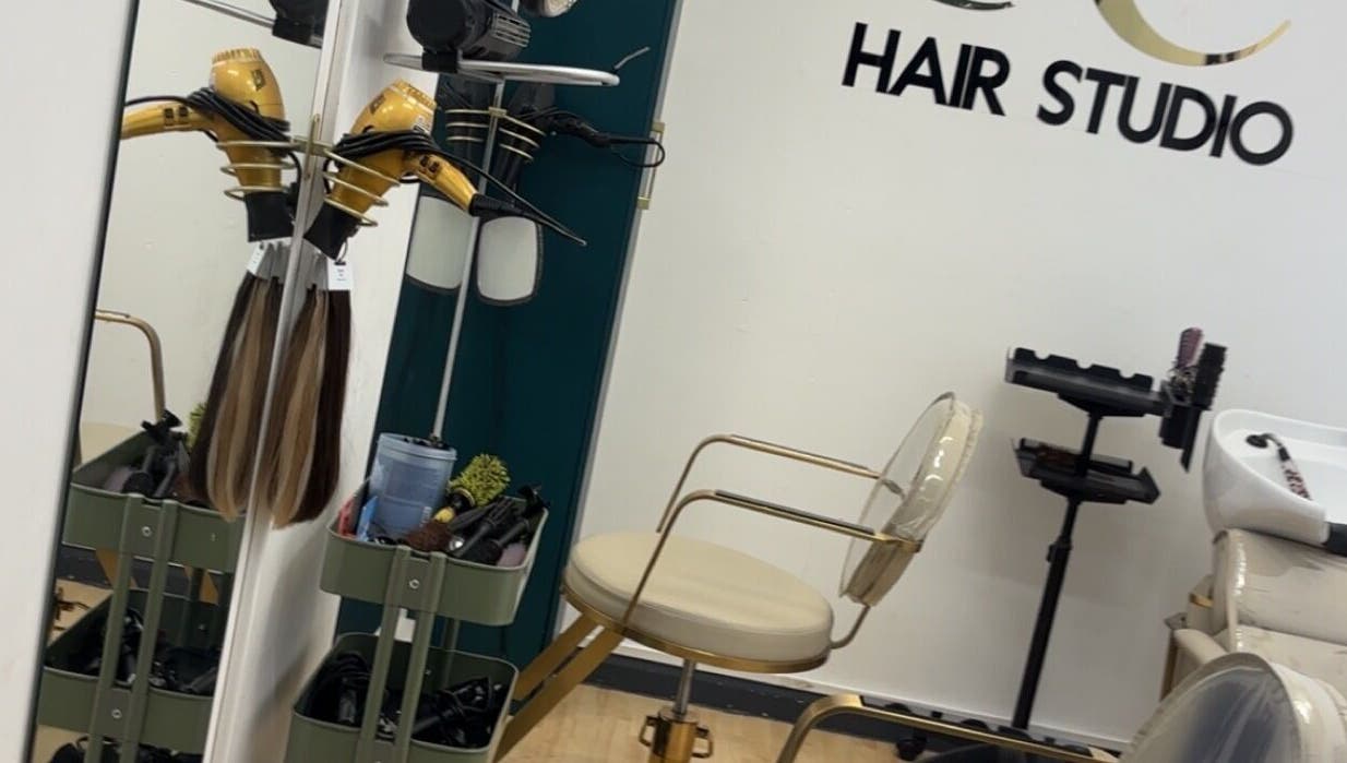 Stylish salon setup at Keratin by Anais in London, England, GB featuring modern hair equipment and seating.