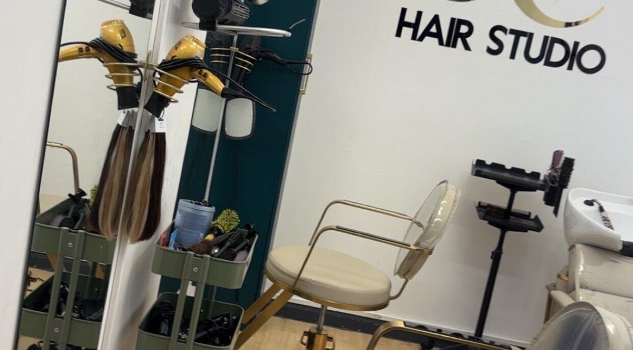 Stylish salon setup at Keratin by Anais in London, England, GB featuring modern hair equipment and seating.