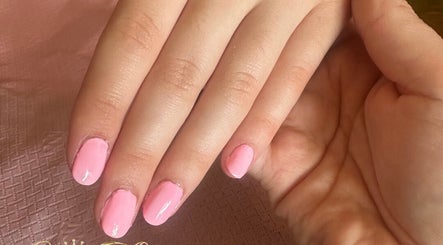 Manicured nails with pink polish at Cece Mol Beauty, York, England, GB.