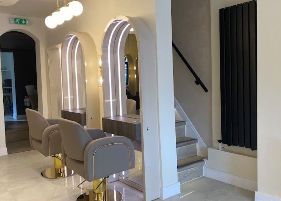 Chic salon at Hair with Geo in Clayton-le-woods, England, GB with modern styling chairs and mirrors.