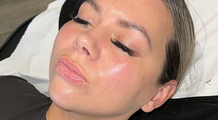 Client enjoying facial treatment at GLOW Skincare & Tanning, Saint Helens, England, GB with flawless results.