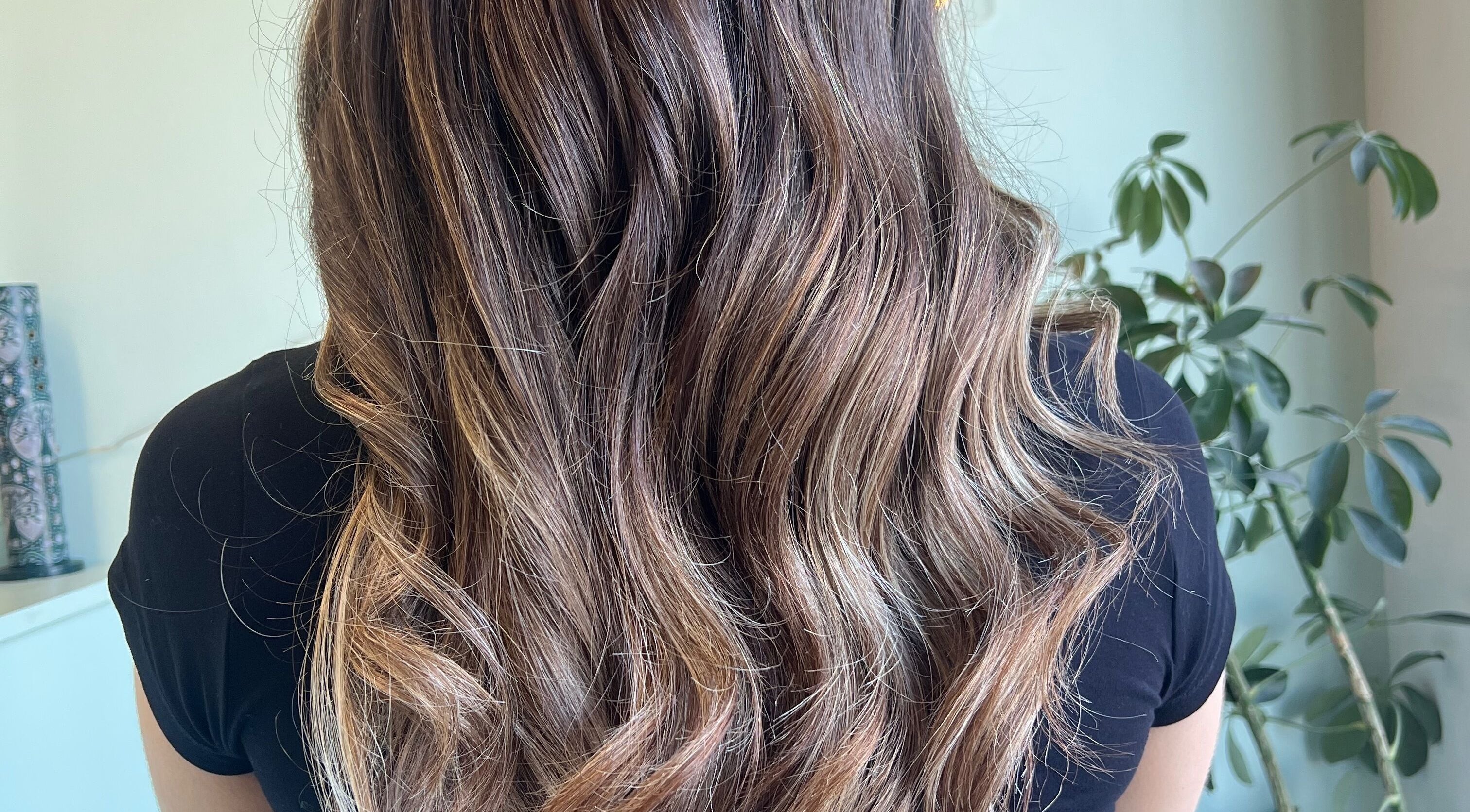 Elegantly styled wavy hair showcasing highlights at Hair with Muireann, Ovens, County Cork, IE.