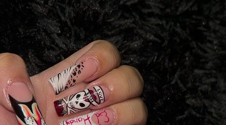 Unique nail art with skull and leopard prints at Polished by Meg, Country Club, Florida, US.
