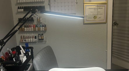 Nail polish display and workspace at Polished by Meg, Country Club, Florida, US, showcasing beauty professionalism.