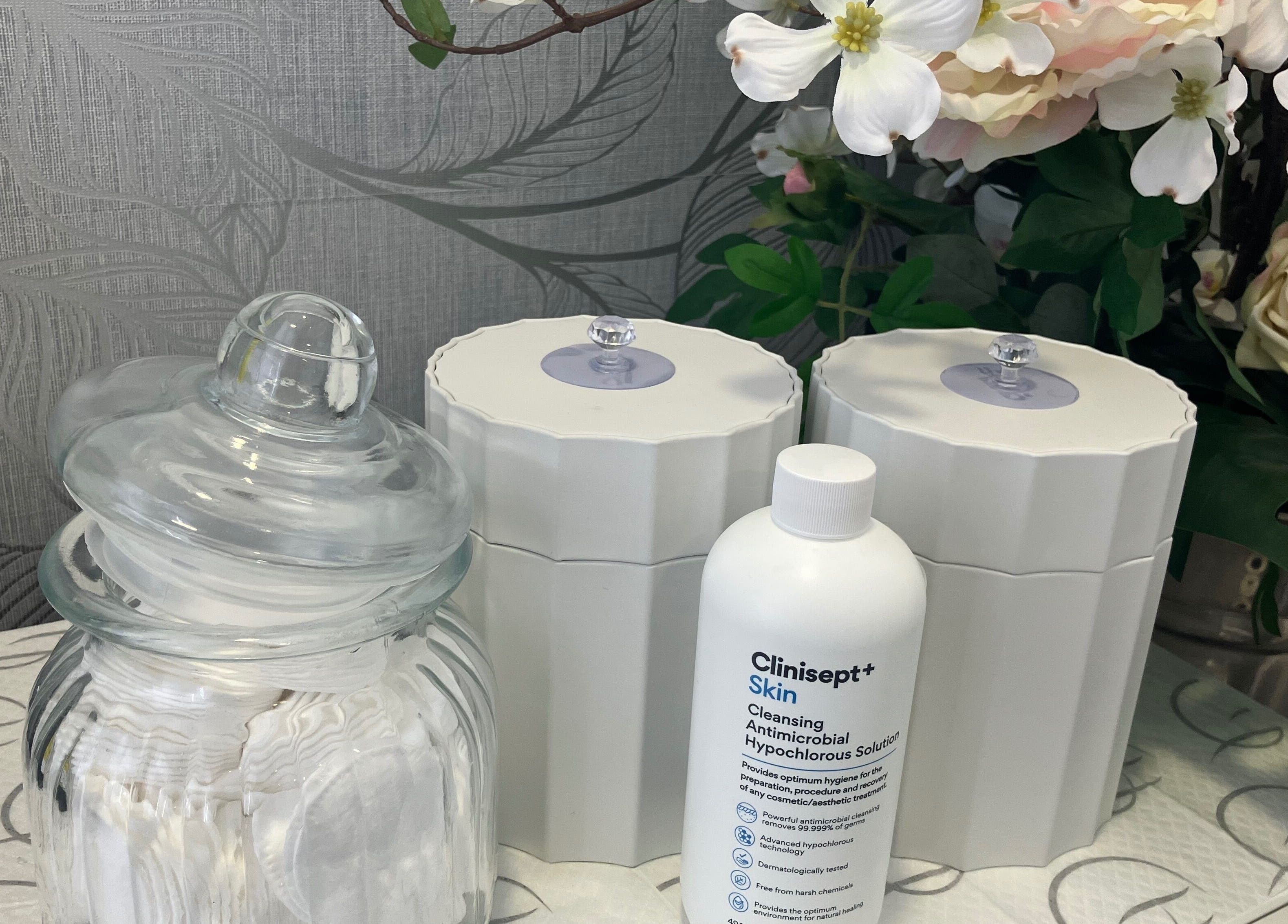 Serene skincare display at Anja Gosha, Cardiff, Wales, GB featuring elegant glass jars and product essentials.