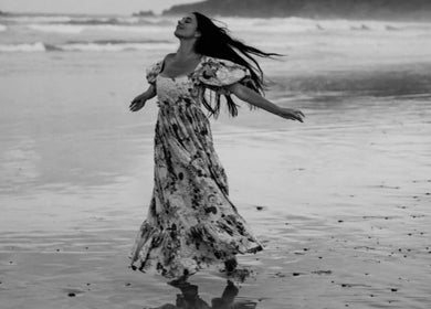 Woman enjoying ocean breeze near Leah Patara Birth Doula in Red Hill, Victoria, AU.