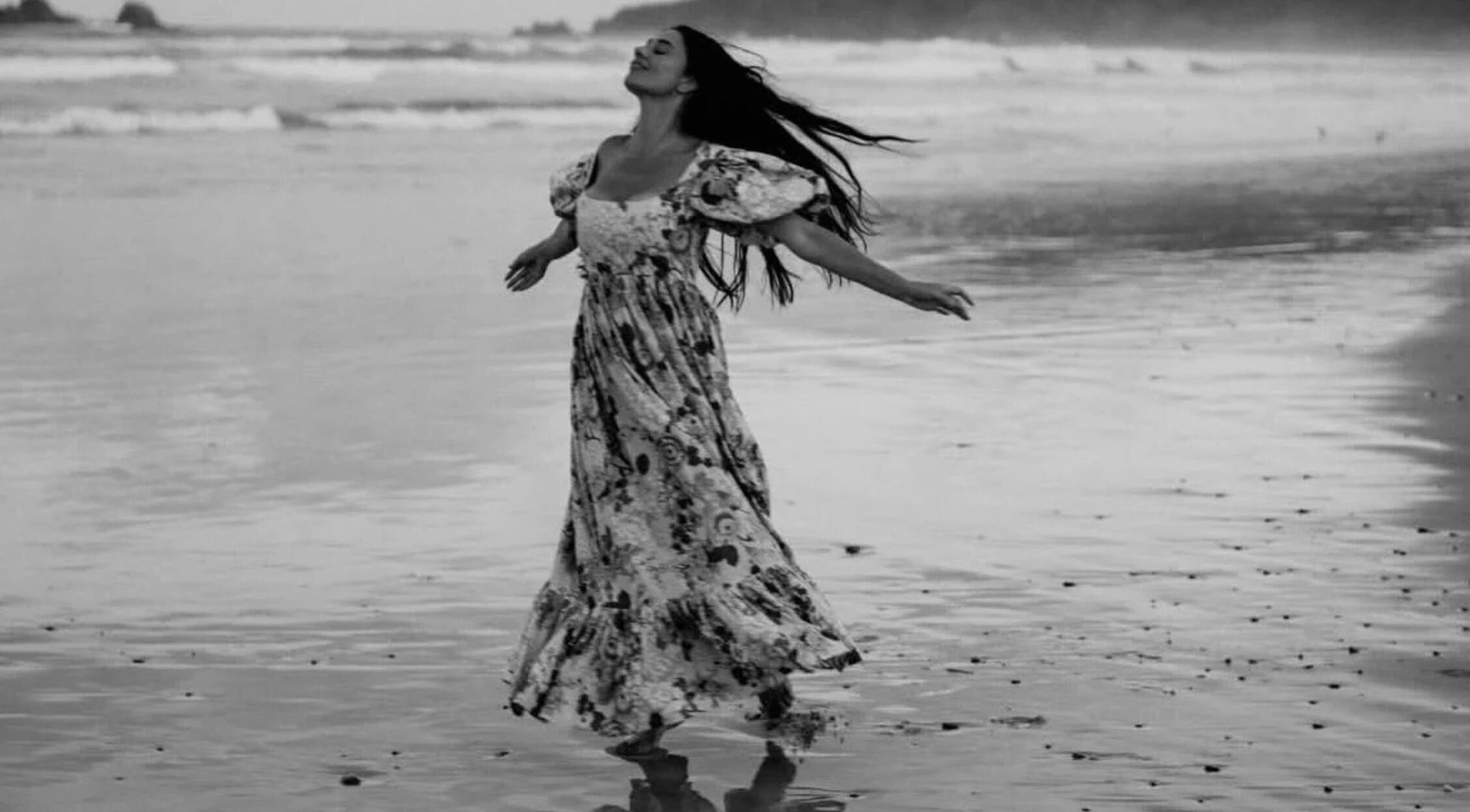 Woman enjoying ocean breeze near Leah Patara Birth Doula in Red Hill, Victoria, AU.