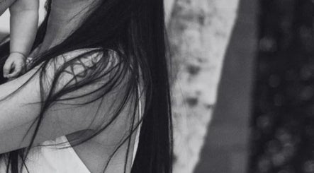 Black and white image at Leah Patara Birth Doula, Red Hill, Victoria, AU, showing a gentle embrace.