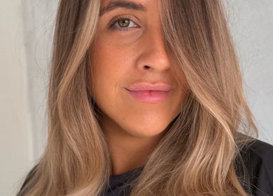 Close-up of a woman with styled hair at Atelier Annelise, Port Kembla, New South Wales, AU.