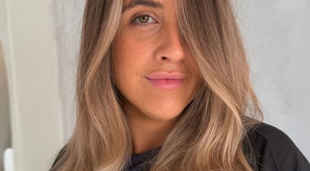 Close-up of a woman with styled hair at Atelier Annelise, Port Kembla, New South Wales, AU.