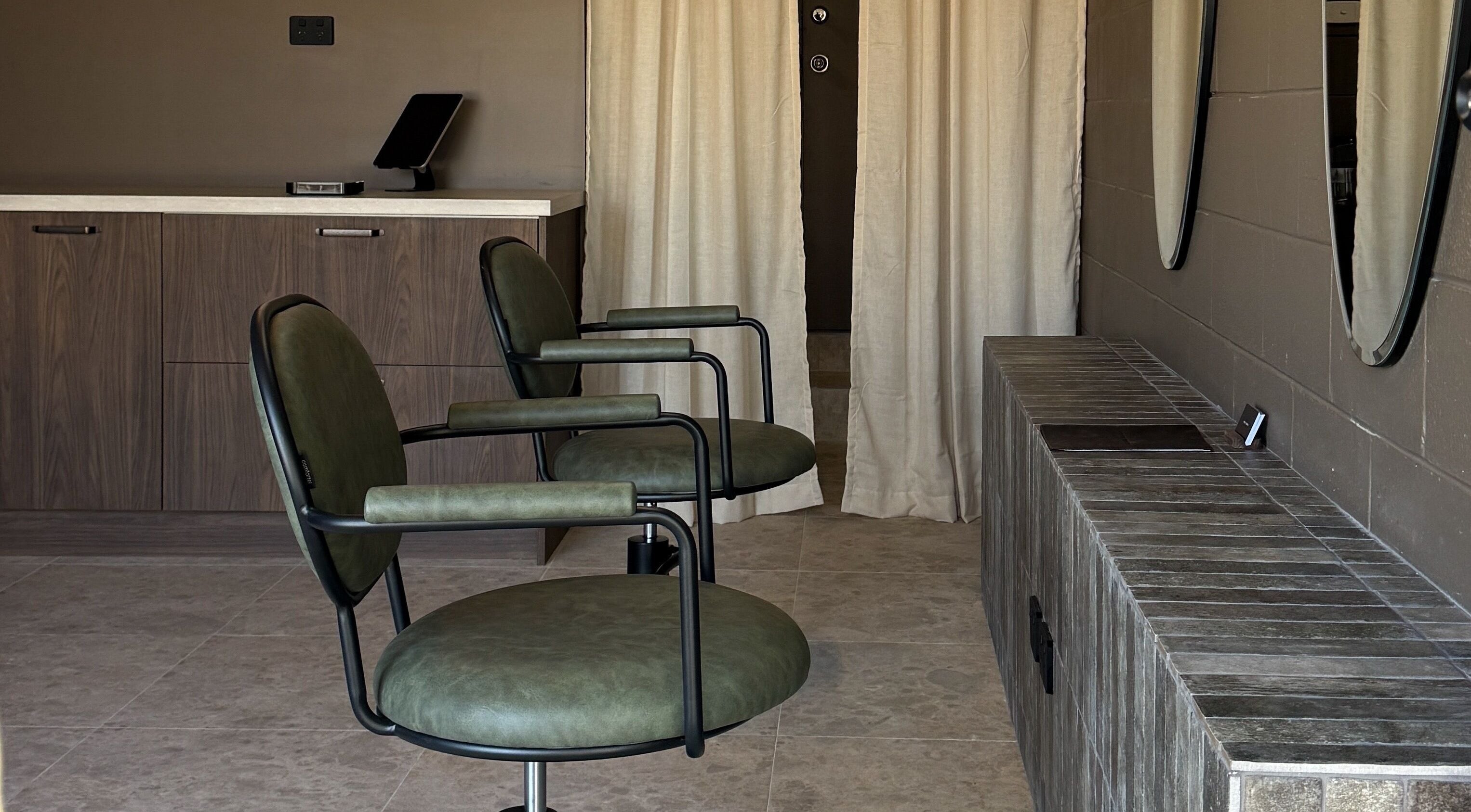 Elegant salon chairs and mirrors at Atelier Annelise in Port Kembla, New South Wales, AU.