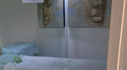 Tranquility Massage Therapy room in La, England, GB with calming decor and massage beds.