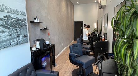 Modern interior of SAVANT Williamsburg salon in New York, New York, US showcasing stylist and sleek decor.