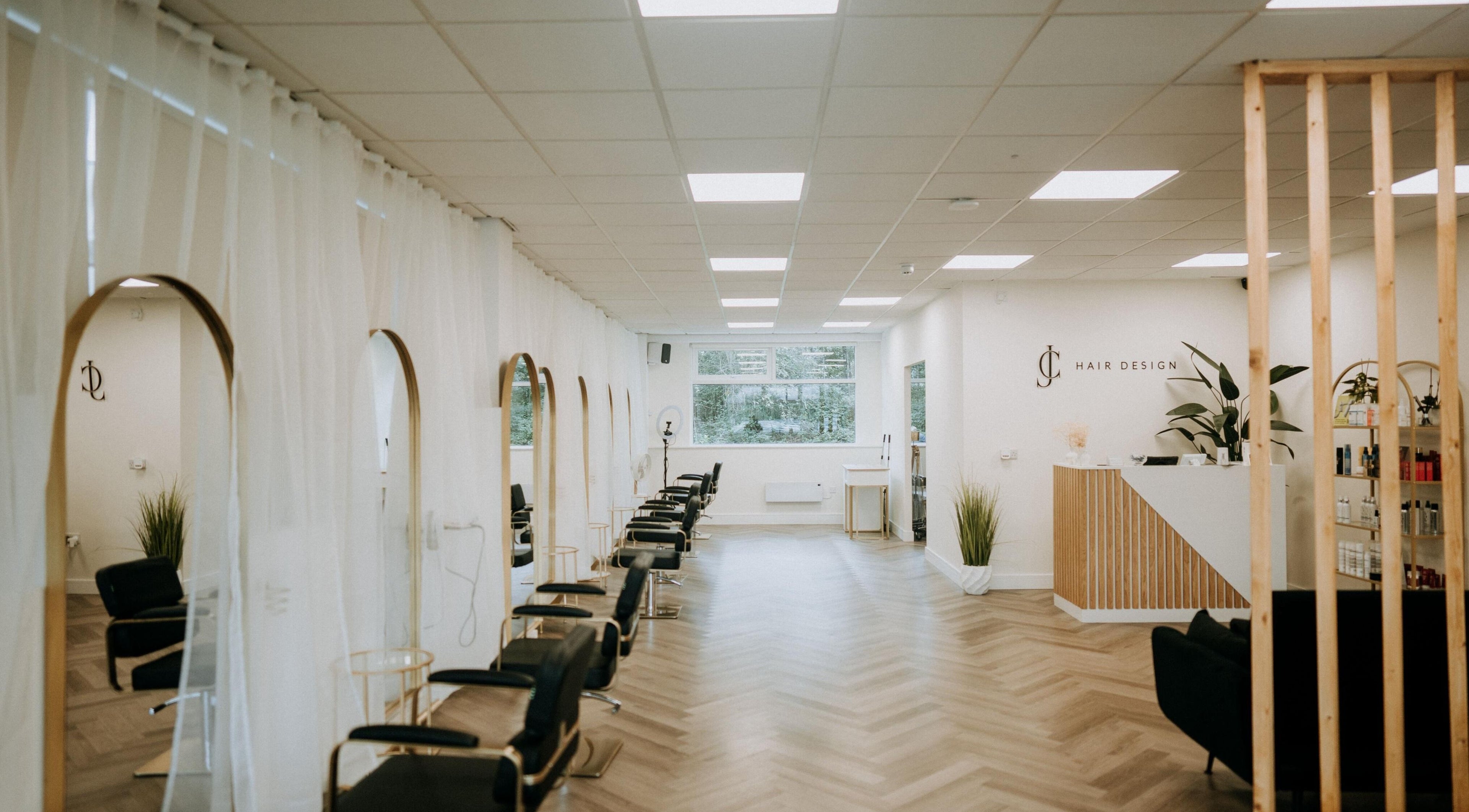 Modern interior of Gavin Alexander & Nicola Heslop @ Jc Hair Design in Cardiff, Wales, GB with elegant styling chairs.