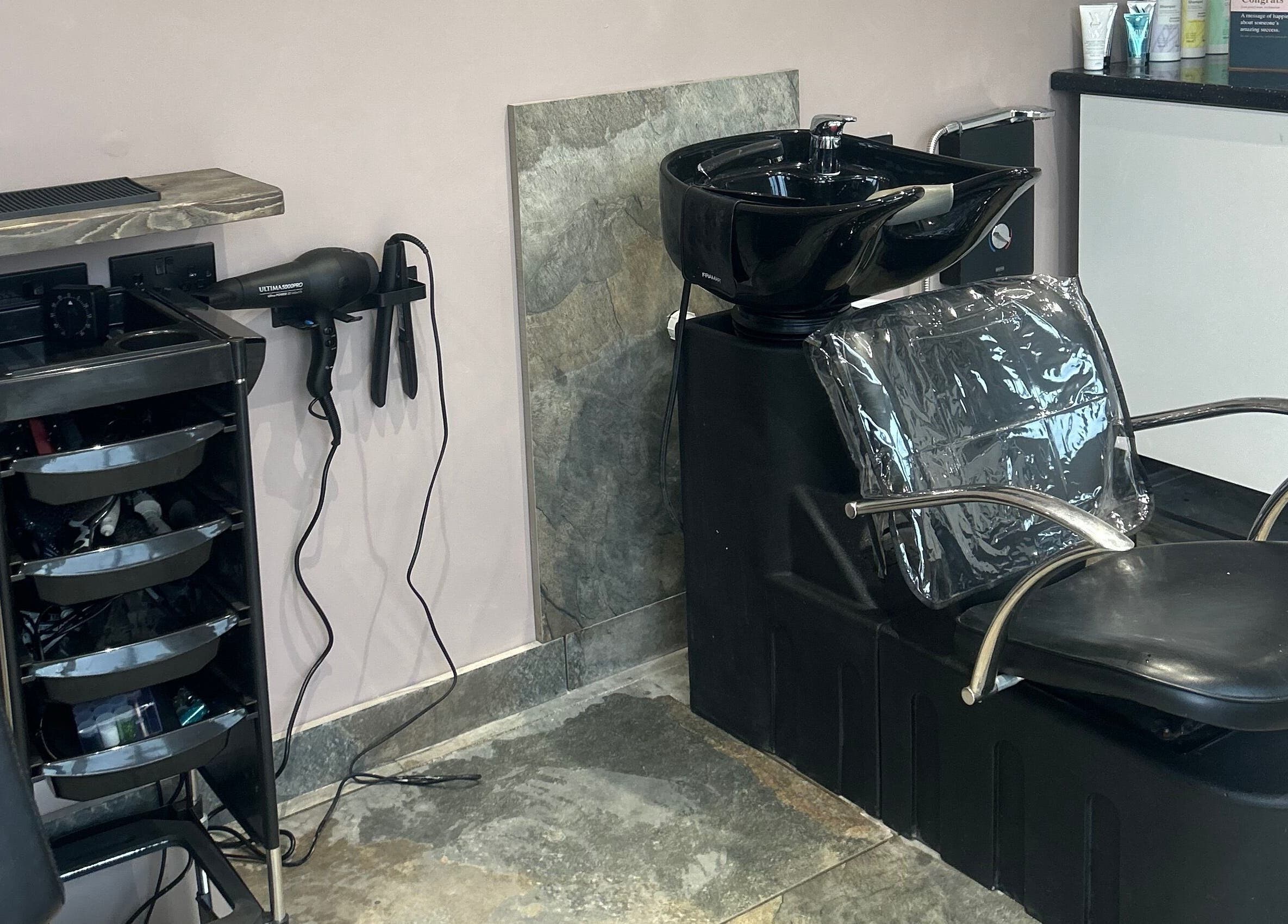 Modern wash station at The Hair Studio, Ellesmere Port, England, GB equipped with hairdressing tools.