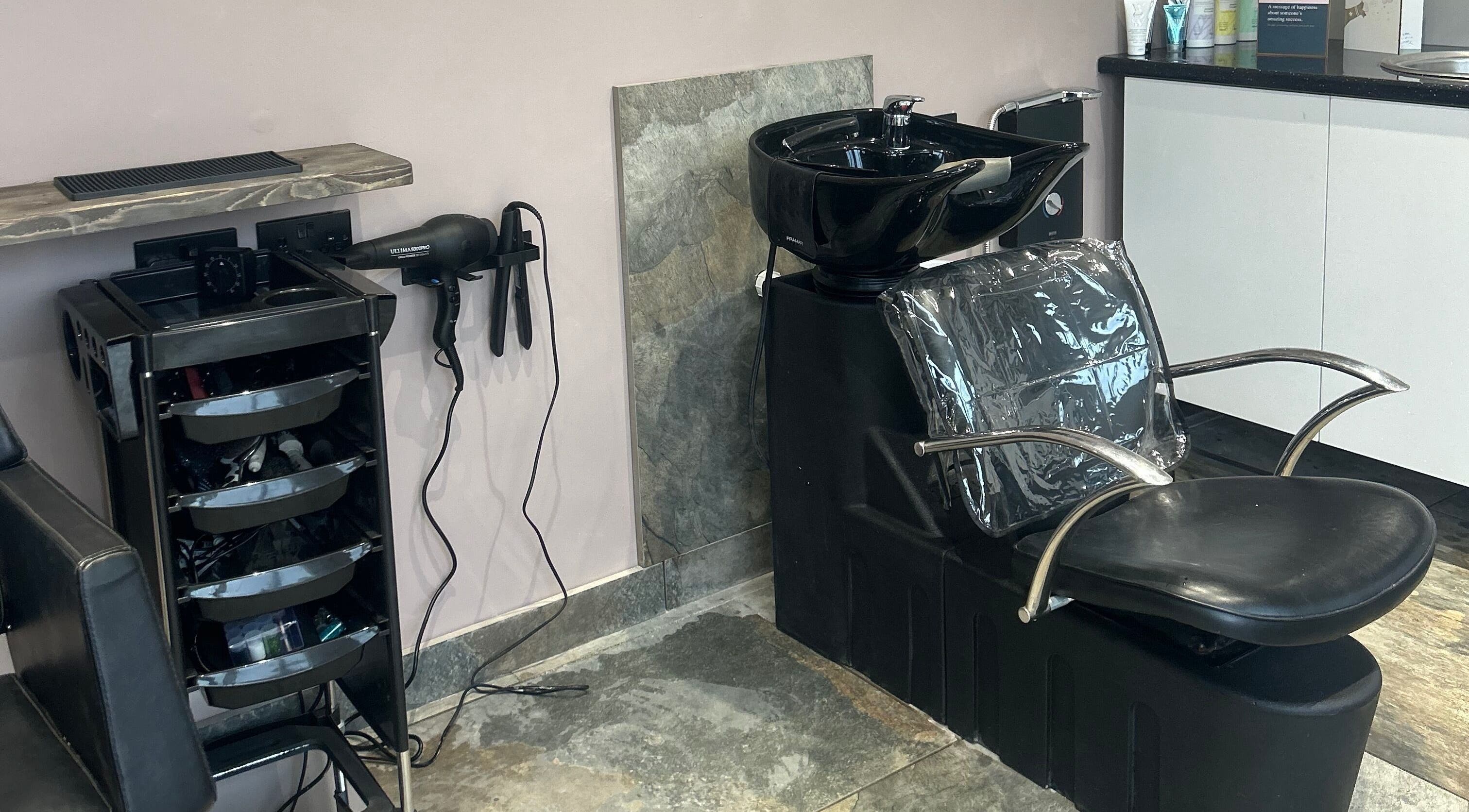 Modern wash station at The Hair Studio, Ellesmere Port, England, GB equipped with hairdressing tools.