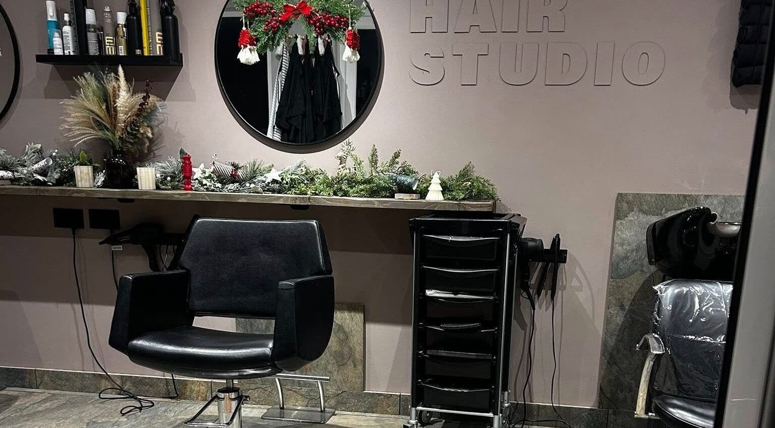 Modern salon chair and decor at The Hair Studio, Ellesmere Port, England, GB.