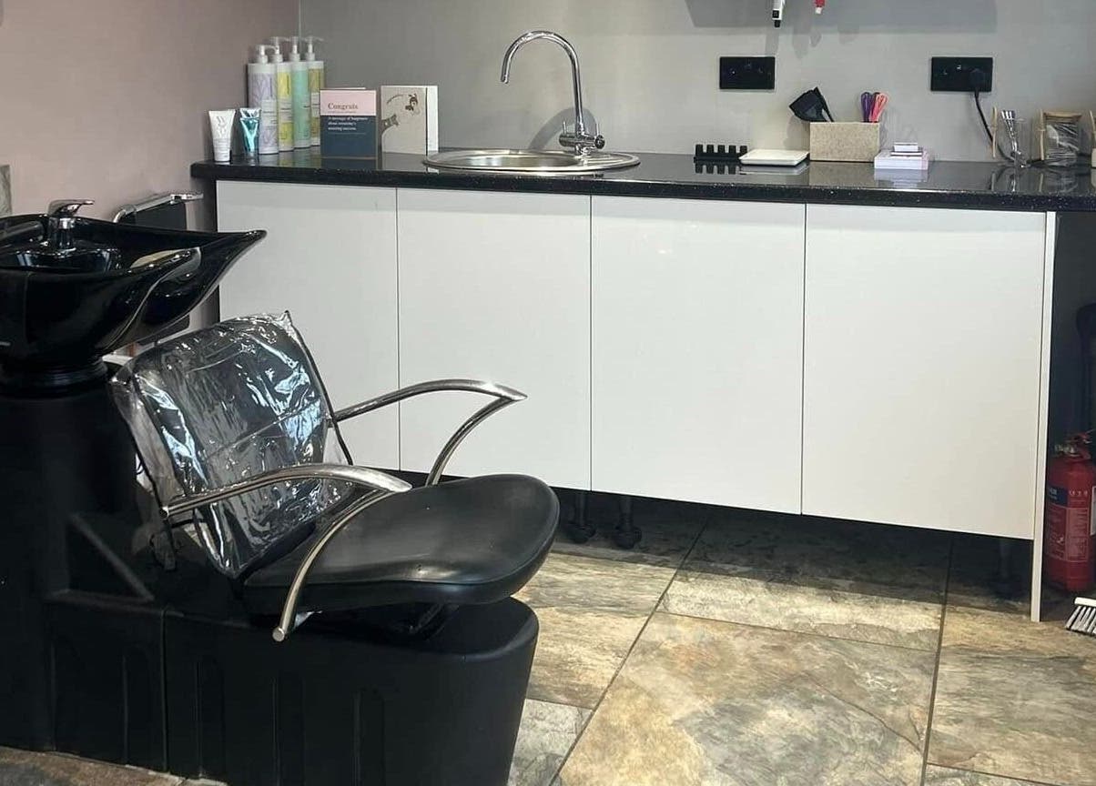 Sleek wash station at The Hair Studio, Ellesmere Port, England, GB, showcasing modern salon amenities.
