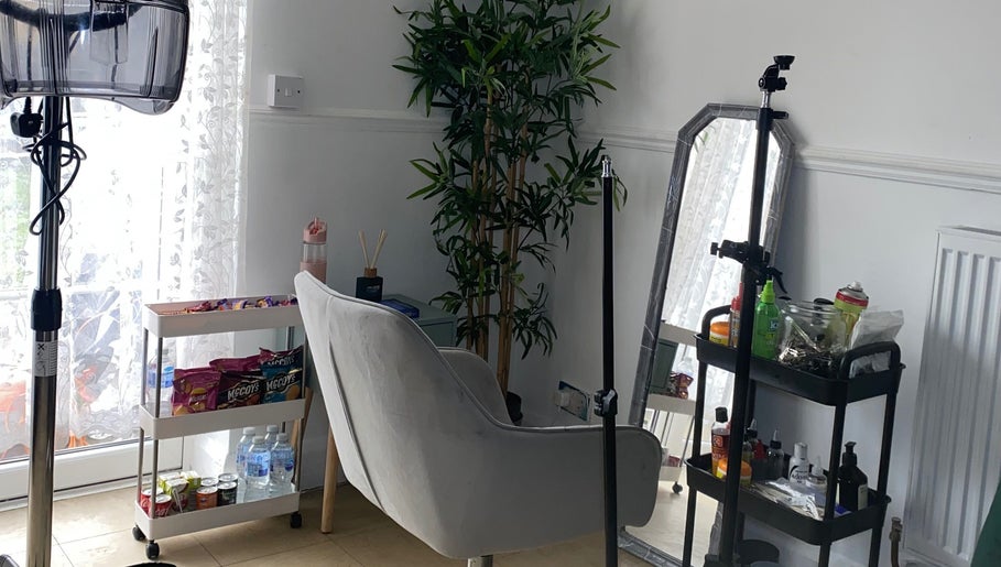 Cozy styling nook at Kovalocs, London, England, GB with lush plants and modern decor.