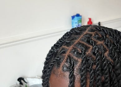 Intricate braided hairstyle at Kovalocs in London, England, GB showcasing expert styling.