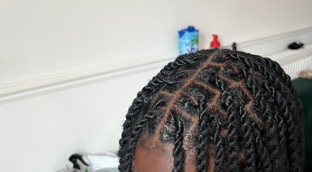 Intricate braided hairstyle at Kovalocs in London, England, GB showcasing expert styling.