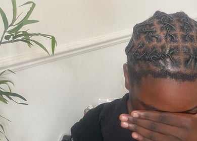 Intricate twists hairstyle at Kovalocs, London, England, GB.