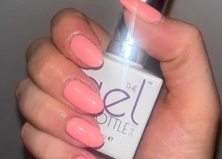 Elegant coral nails at The Secret Salon, West Malling, England, GB, showcasing professional gel polish.
