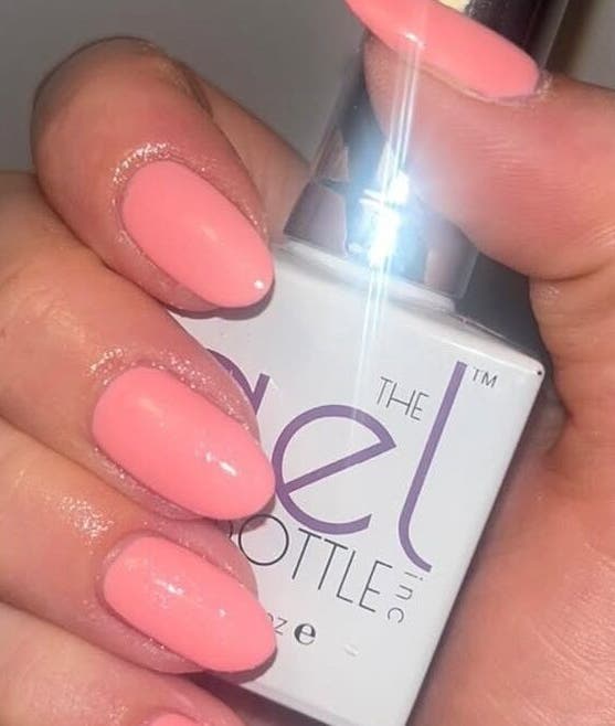 Elegant coral nails at The Secret Salon, West Malling, England, GB, showcasing professional gel polish.