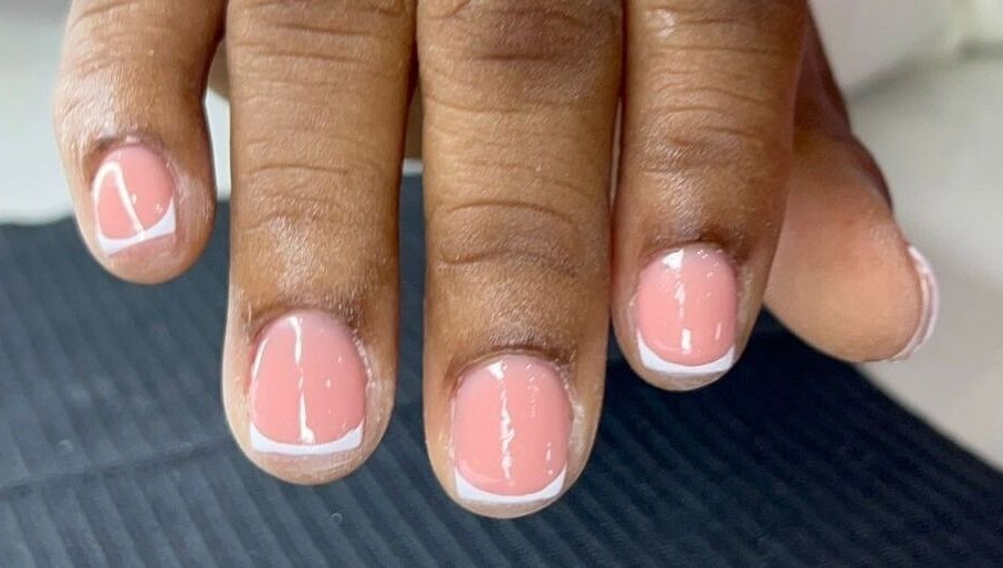 Elegant French manicure at Classy Rose Nail Studio in Sxm, SXM, SX. Perfectly polished nails.